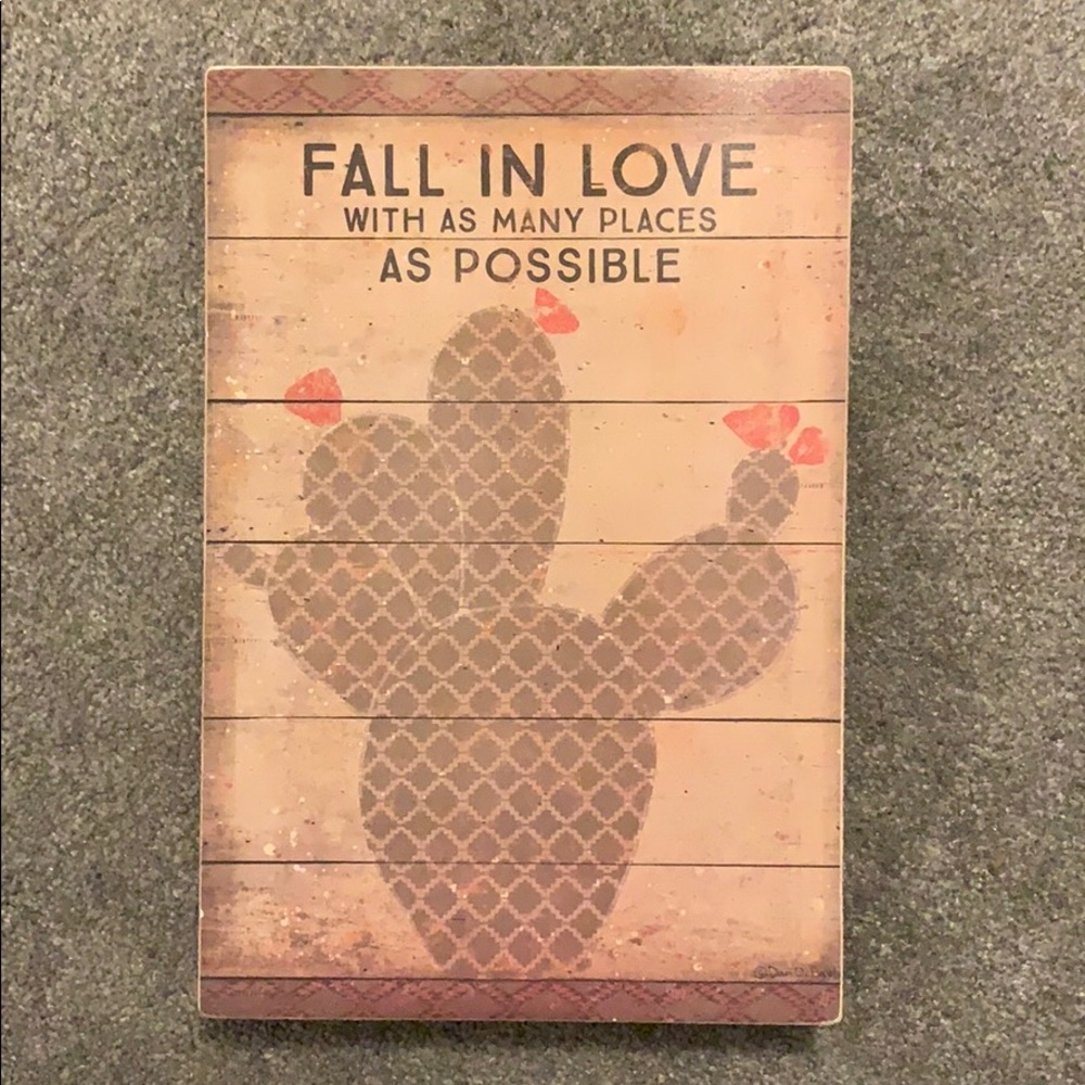 wooden sign with cactus and quote